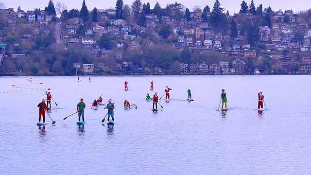 Santa Paddle makes waves for families facing cancer Santa Paddle on Lake Washington
